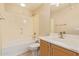 Bathroom featuring a tub/shower combo, toilet, a vanity and updated fixtures at 2121 W Tallgrass Trl # 126, Phoenix, AZ 85085