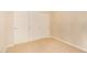 Bedroom features neutral carpet, a double door closet and a single door closet at 2121 W Tallgrass Trl # 126, Phoenix, AZ 85085