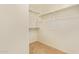 Walk-in closet with shelving and hanging space for organized storage at 2121 W Tallgrass Trl # 126, Phoenix, AZ 85085