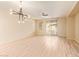 Spacious living room with lots of natural light, wood-style flooring, and a modern ceiling fan at 2121 W Tallgrass Trl # 126, Phoenix, AZ 85085