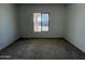 Bright bedroom with carpet and large window at 22874 E Alyssa Rd, Queen Creek, AZ 85142