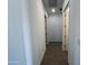 Clean hallway with tile floors and access to other rooms at 22874 E Alyssa Rd, Queen Creek, AZ 85142