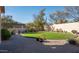 Landscaped backyard with putting green and walkway at 2430 W Horsetail Trl, Phoenix, AZ 85085