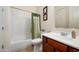 Clean bathroom with shower/tub combo and wood vanity at 2430 W Horsetail Trl, Phoenix, AZ 85085