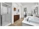 Luxurious bathroom featuring a shower, soaking tub, and double vanity at 2430 W Horsetail Trl, Phoenix, AZ 85085
