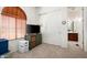 Bedroom with TV and adjacent bathroom at 2430 W Horsetail Trl, Phoenix, AZ 85085
