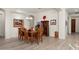 Bright dining room with hardwood floors and a charming wooden table at 2430 W Horsetail Trl, Phoenix, AZ 85085