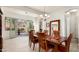 Elegant dining room with hardwood floors, patio access, and chandelier at 2430 W Horsetail Trl, Phoenix, AZ 85085