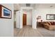 Light and spacious entryway with wood flooring and view to living room at 2430 W Horsetail Trl, Phoenix, AZ 85085