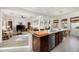 Open kitchen with island and views into the living room and backyard at 2430 W Horsetail Trl, Phoenix, AZ 85085