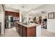 Open kitchen with island, stainless steel appliances, and view of living room at 2430 W Horsetail Trl, Phoenix, AZ 85085