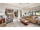 Open living room with views of the kitchen and backyard at 2430 W Horsetail Trl, Phoenix, AZ 85085