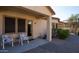 Covered patio with seating area, screened windows, and brick pathway at 2430 W Horsetail Trl, Phoenix, AZ 85085