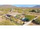 Stunning aerial view of the home and backyard featuring a pool and meticulously landscaped desert environment at 3701 E Sat Nam Way, Cave Creek, AZ 85331