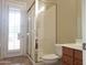 Bright bathroom with tile floors, glass shower, and natural light from the patio door at 3701 E Sat Nam Way, Cave Creek, AZ 85331