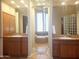 Bathroom with double sinks, a bathtub, and a large mirror at 3701 E Sat Nam Way, Cave Creek, AZ 85331