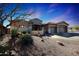 Charming single-story home with a three-car garage and desert landscaping at 3701 E Sat Nam Way, Cave Creek, AZ 85331
