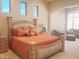 Spacious main bedroom boasts a large bed, sitting area, and plenty of natural light at 3701 E Sat Nam Way, Cave Creek, AZ 85331