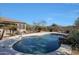 Backyard pool with clear water, rock features and desert landscaping at 3701 E Sat Nam Way, Cave Creek, AZ 85331