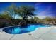 Beautiful private pool with rock waterfall feature and desert landscaping at 3701 E Sat Nam Way, Cave Creek, AZ 85331
