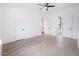 Bright bedroom featuring hardwood floors and ceiling fan at 4411 E Gemini Pl, Chandler, AZ 85249