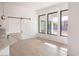 Bright dining area with hardwood floors and sliding barn door at 4411 E Gemini Pl, Chandler, AZ 85249