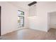 Elegant dining room with hardwood floors and a large modern chandelier at 4411 E Gemini Pl, Chandler, AZ 85249