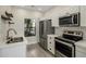 Modern kitchen with white shaker cabinets, stainless steel appliances, and subway tile backsplash at 9600 N 96Th St # 130, Scottsdale, AZ 85258