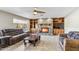 Spacious living room featuring a stone fireplace, built-in shelving, and comfortable seating at 1045 E Cloud Rd, Phoenix, AZ 85086