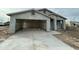 Newly constructed home with attached garage and open driveway at 11474 N 79Th Dr, Peoria, AZ 85345