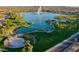 Aerial view of community lake with fountain, lush green spaces, walking paths, and neatly landscaped islands at 14645 N Fountain Hills Blvd # 114, Fountain Hills, AZ 85268