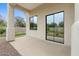 Modern sliding glass doors on a covered patio seamlessly connect the interior with a beautifully landscaped yard at 2121 N Orchard --, Mesa, AZ 85213