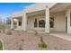 Covered patio view showcasing desert landscaping, modern architecture, and seamless indoor-outdoor living at 2121 N Orchard --, Mesa, AZ 85213