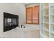 Luxurious bathroom with corner tub, fireplace, wood shutters, and glass brick shower wall at 2121 N Orchard --, Mesa, AZ 85213