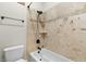 Bathroom with a shower-tub combination and decorative tile at 2121 N Orchard --, Mesa, AZ 85213