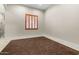 Vacant bedroom with carpet and a shuttered window at 2121 N Orchard --, Mesa, AZ 85213