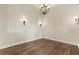 Dining room showcasing hardwood floors, decorative lighting, and a classic chandelier at 2121 N Orchard --, Mesa, AZ 85213