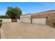 Spacious three-car garage with brick driveway and stone accents, providing ample parking and curb appeal at 2121 N Orchard --, Mesa, AZ 85213