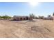 House and large yard with tree and shed in background at 35852 N 10Th St, Phoenix, AZ 85086