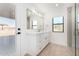 Modern bathroom with white vanity, glass shower, and wood-look tile floor at 35852 N 10Th St, Phoenix, AZ 85086