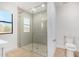 Modern bathroom with a large glass shower and white toilet at 35852 N 10Th St, Phoenix, AZ 85086