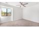 Spacious bedroom with ceiling fan and neutral carpeting at 35852 N 10Th St, Phoenix, AZ 85086