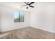 Simple bedroom with hardwood floors and a window at 35852 N 10Th St, Phoenix, AZ 85086