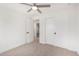 Bedroom with ceiling fan, carpet flooring, and sliding door closet at 35852 N 10Th St, Phoenix, AZ 85086