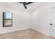 Spacious bedroom with ceiling fan and large window at 35852 N 10Th St, Phoenix, AZ 85086