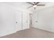 Bright bedroom with ceiling fan and neutral carpeting at 35852 N 10Th St, Phoenix, AZ 85086