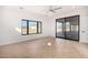 Bedroom with sliding glass doors to patio and large windows at 35852 N 10Th St, Phoenix, AZ 85086