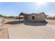 Tan house with covered entryway and paved driveway, desert landscaping at 35852 N 10Th St, Phoenix, AZ 85086