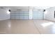 Two-car garage with epoxy flooring and overhead lighting at 35852 N 10Th St, Phoenix, AZ 85086