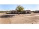 Back of tan house with covered patio and large yard at 35852 N 10Th St, Phoenix, AZ 85086